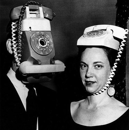 two-people-with-phones-on-head.jpg
